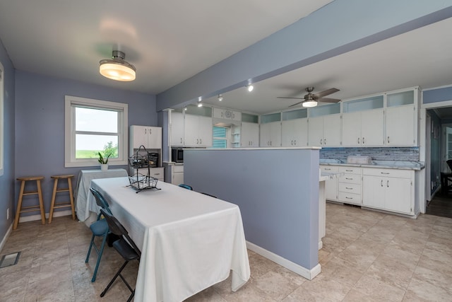43867 County Road 15, New Sweden Twp, MN 56074 - dining space featuring baseboards and ceiling fan