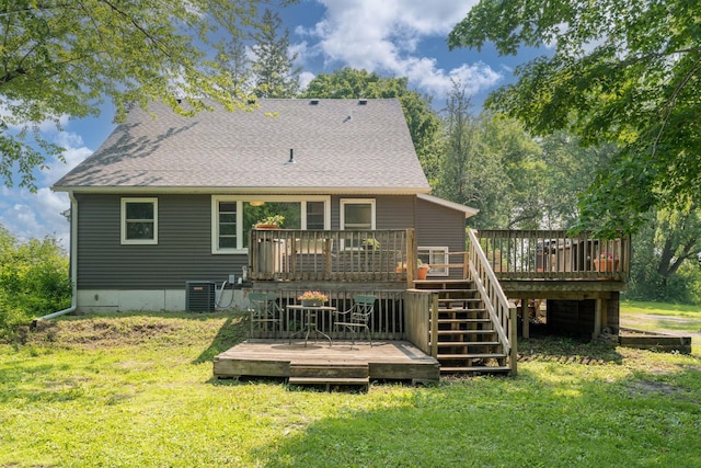 43867 County Road 15, New Sweden Twp, MN 56074 - back of house with a yard, a wooden deck, a shingled roof, and stairway