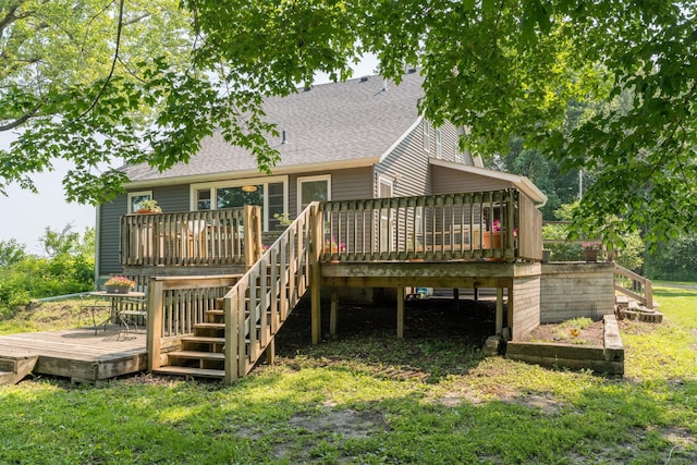 43867 County Road 15, New Sweden Twp, MN 56074 - rear view of house with stairs, a deck, roof with shingles, and a yard