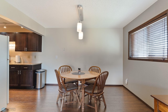 1129 22nd St S Unit B12, Fargo, ND 58103 - dining area featuring wood finished floors and rail lighting