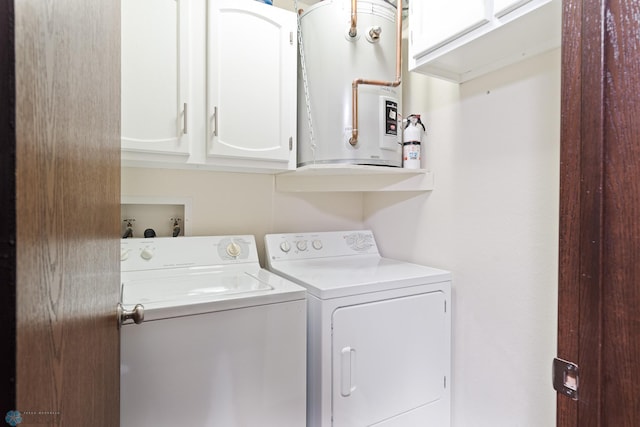 1129 22nd St S Unit B12, Fargo, ND 58103 - laundry room featuring washing machine and dryer, cabinet space, and water heater