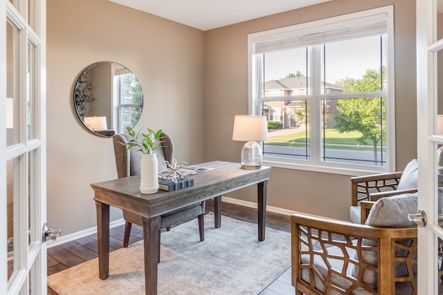 10329 Kentucky Ave N, Brooklyn Park, MN 55445 - office area with baseboards and wood finished floors