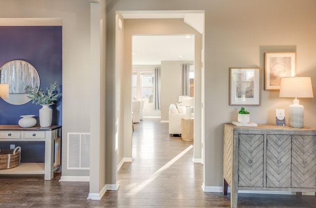 10329 Kentucky Ave N, Brooklyn Park, MN 55445 - corridor featuring wood finished floors and baseboards