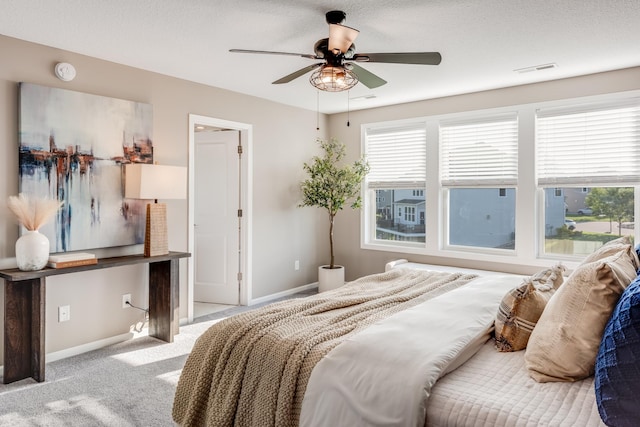 10329 Kentucky Ave N, Brooklyn Park, MN 55445 - carpeted bedroom with baseboards and ceiling fan