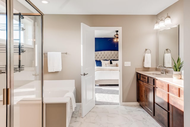 10329 Kentucky Ave N, Brooklyn Park, MN 55445 - ensuite bathroom featuring vanity, a garden tub, a ceiling fan, recessed lighting, and marble look tile flooring