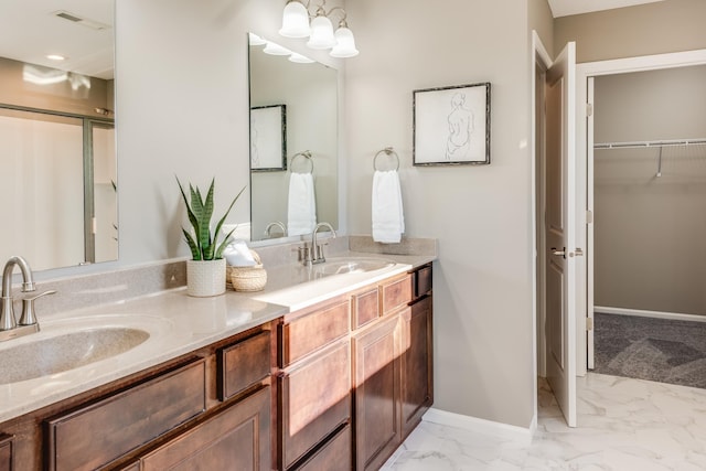10329 Kentucky Ave N, Brooklyn Park, MN 55445 - full bathroom featuring double vanity, marble finish flooring, and a spacious closet