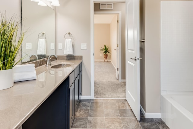 10329 Kentucky Ave N, Brooklyn Park, MN 55445 - bathroom with double vanity and baseboards