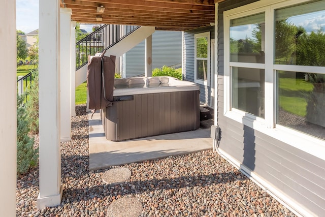 10329 Kentucky Ave N, Brooklyn Park, MN 55445 - view of patio with a hot tub and stairway