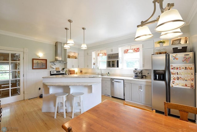 5560 County Road 3, Kindred, ND 58051 - kitchen with appliances with stainless steel finishes, wall chimney exhaust hood, healthy amount of natural light, ornamental molding, and a kitchen island