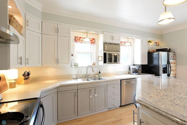 5560 County Road 3, Kindred, ND 58051 - kitchen featuring appliances with stainless steel finishes, a sink, wall chimney exhaust hood, crown molding, and hanging light fixtures