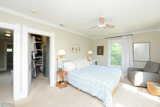 5560 County Road 3, Kindred, ND 58051 - bedroom featuring light colored carpet, a walk in closet, crown molding, a closet, and ceiling fan