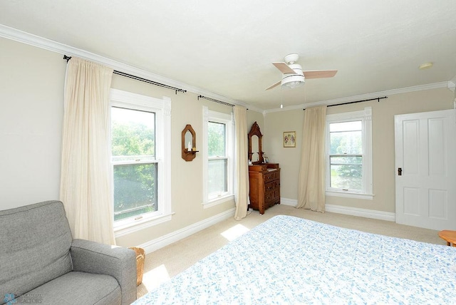 5560 County Road 3, Kindred, ND 58051 - bedroom with light carpet, multiple windows, crown molding, baseboards, and a ceiling fan