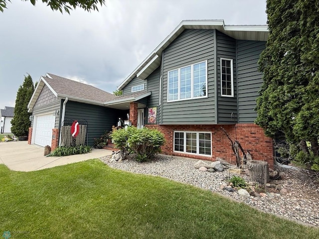 521 Kroshus Dr, Dilworth, MN 56529 - view of front of home with brick siding, an attached garage, a front lawn, central AC unit, and concrete driveway