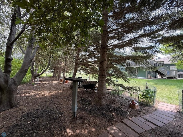 521 Kroshus Dr, Dilworth, MN 56529 - view of community featuring stairway and a yard