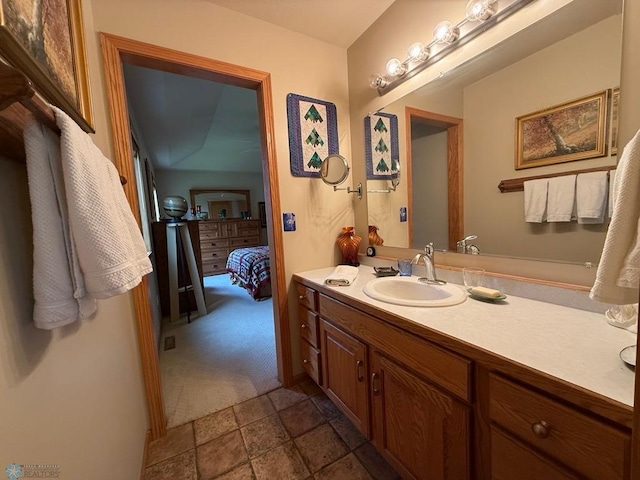 521 Kroshus Dr, Dilworth, MN 56529 - ensuite bathroom featuring vanity and stone finish flooring