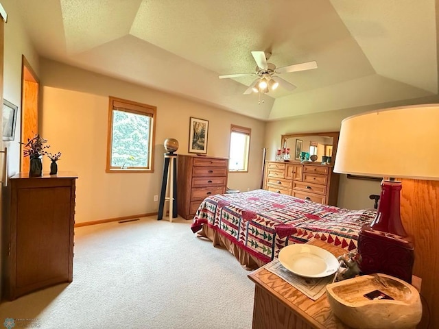 521 Kroshus Dr, Dilworth, MN 56529 - bedroom with a tray ceiling, light colored carpet, baseboards, and a ceiling fan