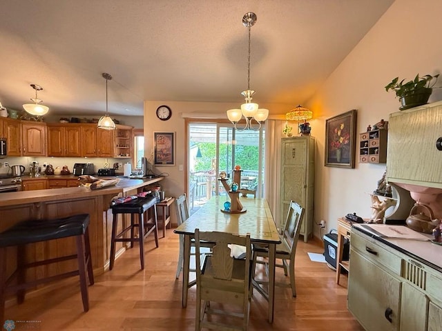521 Kroshus Dr, Dilworth, MN 56529 - dining area featuring a chandelier and light wood-style floors