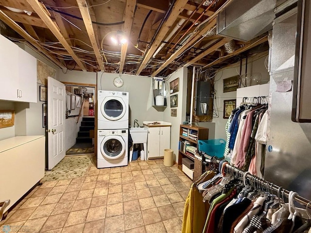 521 Kroshus Dr, Dilworth, MN 56529 - laundry room with stacked washer and clothes dryer and cabinet space