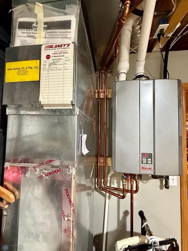521 Kroshus Dr, Dilworth, MN 56529 - utility room with tankless water heater