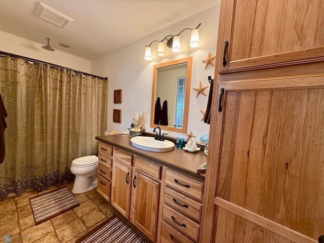 521 Kroshus Dr, Dilworth, MN 56529 - bathroom featuring vanity, toilet, and a shower with curtain