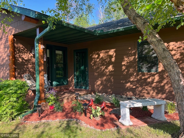 37760 Dove St Unit 14, Aitkin, MN 56431 - view of home's exterior with covered porch and a shingled roof
