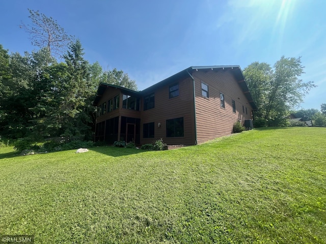 37760 Dove St Unit 14, Aitkin, MN 56431 - rear view of house featuring a yard