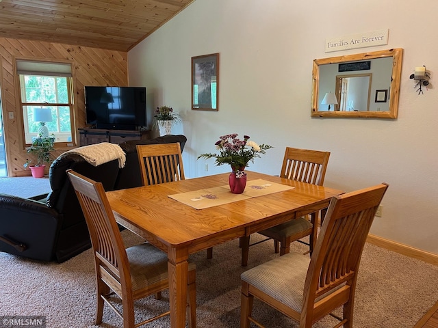 37760 Dove St Unit 14, Aitkin, MN 56431 - dining space with vaulted ceiling, carpet, wood ceiling, and wooden walls