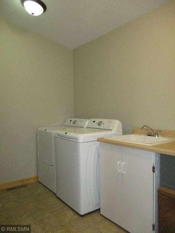 37760 Dove St Unit 14, Aitkin, MN 56431 - laundry room with washing machine and clothes dryer and baseboards