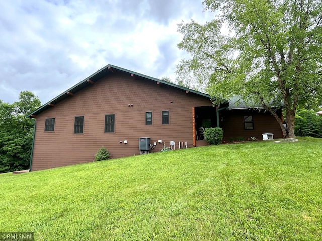 37760 Dove St Unit 14, Aitkin, MN 56431 - view of side of property featuring a lawn and a cooling unit