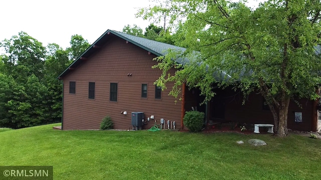 37760 Dove St Unit 14, Aitkin, MN 56431 - view of property exterior featuring a yard and a cooling unit