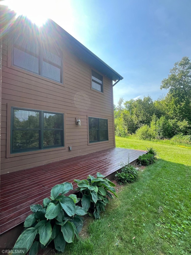 37760 Dove St Unit 14, Aitkin, MN 56431 - back of house featuring a deck and a yard