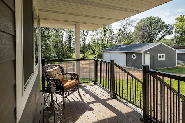 3546 230th St E, Prior Lake, MN 55372 - wooden deck with a detached garage, an outbuilding, and a lawn