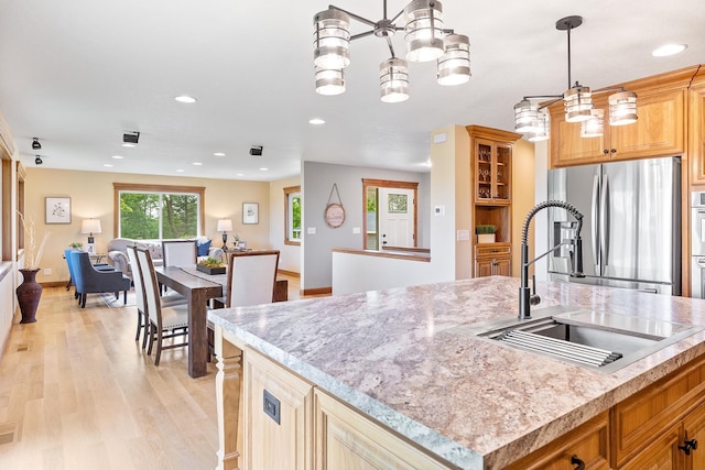 3546 230th St E, Prior Lake, MN 55372 - kitchen with freestanding refrigerator, light wood-style flooring, open floor plan, recessed lighting, and a chandelier