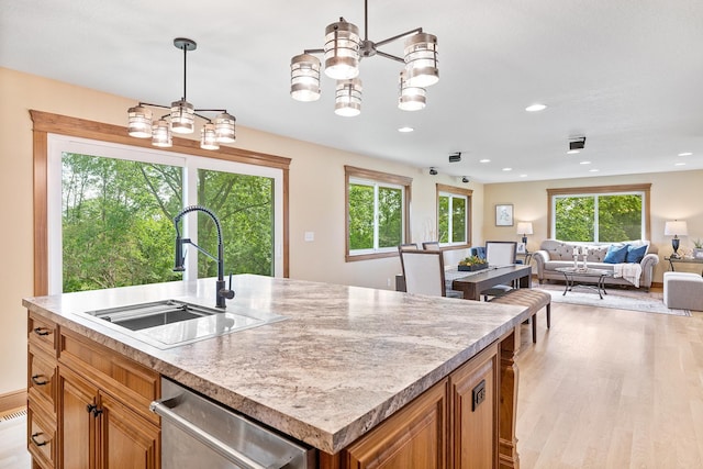 3546 230th St E, Prior Lake, MN 55372 - kitchen featuring dishwasher, a chandelier, light wood finished floors, light countertops, and an island with sink