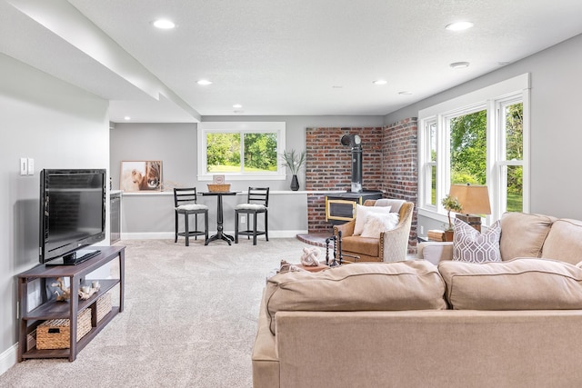 3546 230th St E, Prior Lake, MN 55372 - living area featuring a wood stove, carpet floors, and recessed lighting