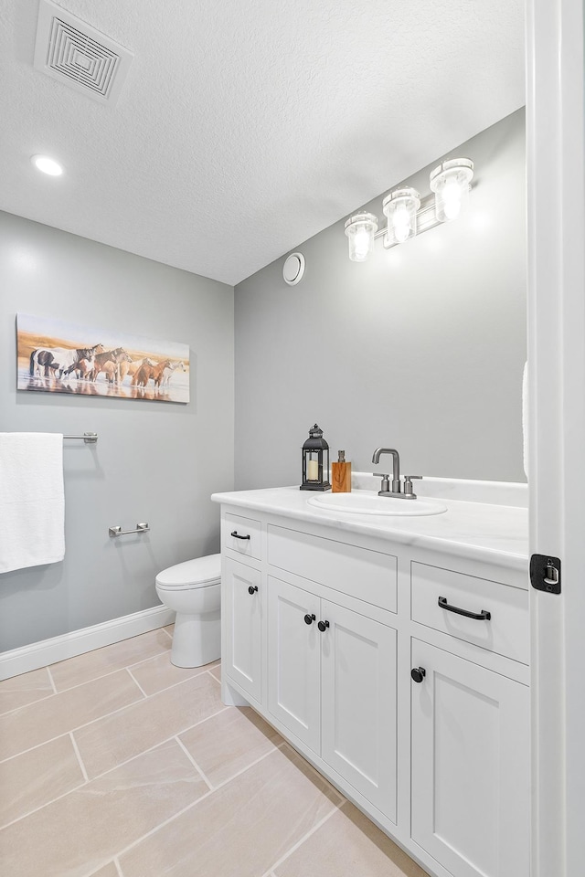 3546 230th St E, Prior Lake, MN 55372 - bathroom featuring vanity, a textured ceiling, and tile patterned floors