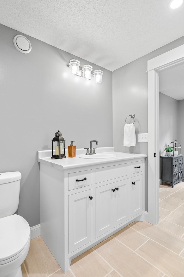 3546 230th St E, Prior Lake, MN 55372 - bathroom with vanity, a textured ceiling, and tile patterned floors