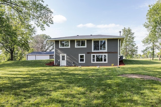 3546 230th St E, Prior Lake, MN 55372 - back of house featuring a lawn and a garage