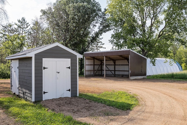 3546 230th St E, Prior Lake, MN 55372 - view of pole building with a carport and driveway
