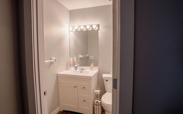 6303 84th Ct N, Brooklyn Park, MN 55445 - bathroom featuring vanity and toilet