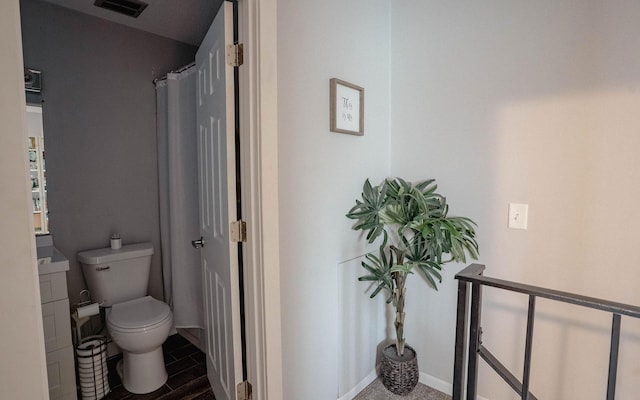 6303 84th Ct N, Brooklyn Park, MN 55445 - full bathroom with toilet and wood finished floors