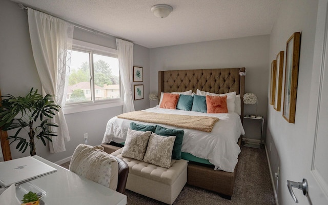 6303 84th Ct N, Brooklyn Park, MN 55445 - carpeted bedroom featuring a textured ceiling and baseboards