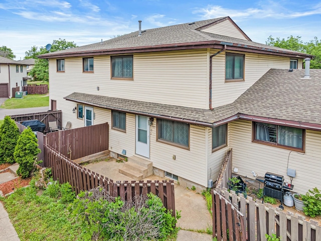 6303 84th Ct N, Brooklyn Park, MN 55445 - view of front facade featuring entry steps, roof with shingles, and a fenced backyard