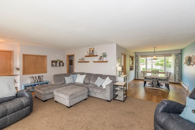 471 Tyrol Dr, Brainerd, MN 56401 - carpeted living area featuring a baseboard heating unit and wood finished floors
