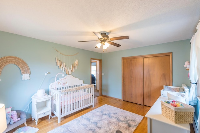 471 Tyrol Dr, Brainerd, MN 56401 - bedroom featuring a closet, light wood finished floors, a ceiling fan, and baseboards