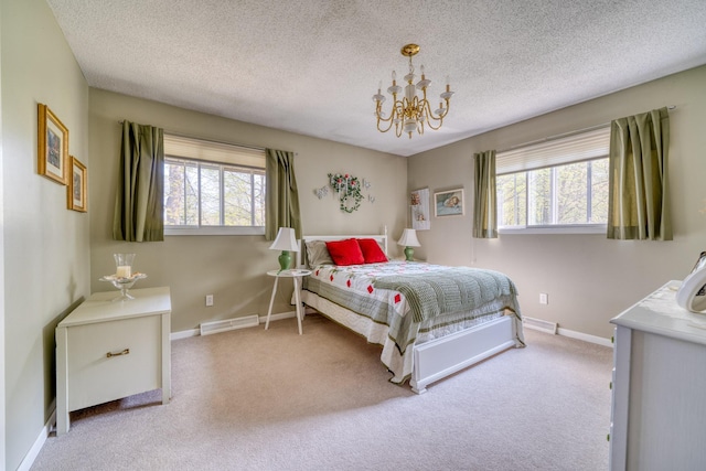 33240 Gary Dr, Grand Rapids, MN 55744 - bedroom featuring carpet, a chandelier, baseboards, and a textured ceiling