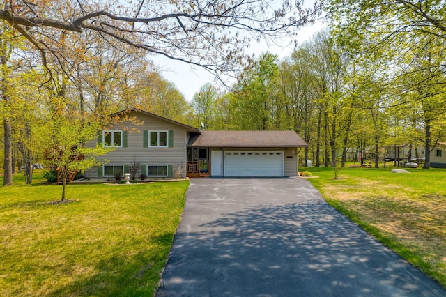 33240 Gary Dr, Grand Rapids, MN 55744 - view of front of home with driveway, an attached garage, and a front lawn