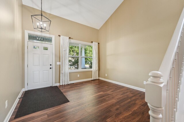 1741 Prescott Ln, Chaska, MN 55318 - foyer entrance featuring a chandelier, dark wood-style flooring, high vaulted ceiling, and baseboards