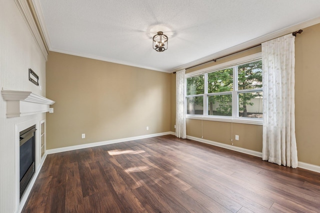 1741 Prescott Ln, Chaska, MN 55318 - unfurnished living room featuring crown molding, wood finished floors, a glass covered fireplace, baseboards, and a textured ceiling