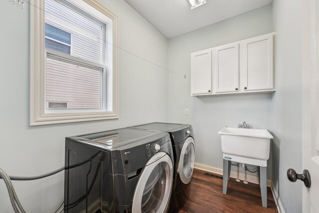 1741 Prescott Ln, Chaska, MN 55318 - laundry room featuring washing machine and clothes dryer, cabinet space, dark wood-type flooring, and baseboards